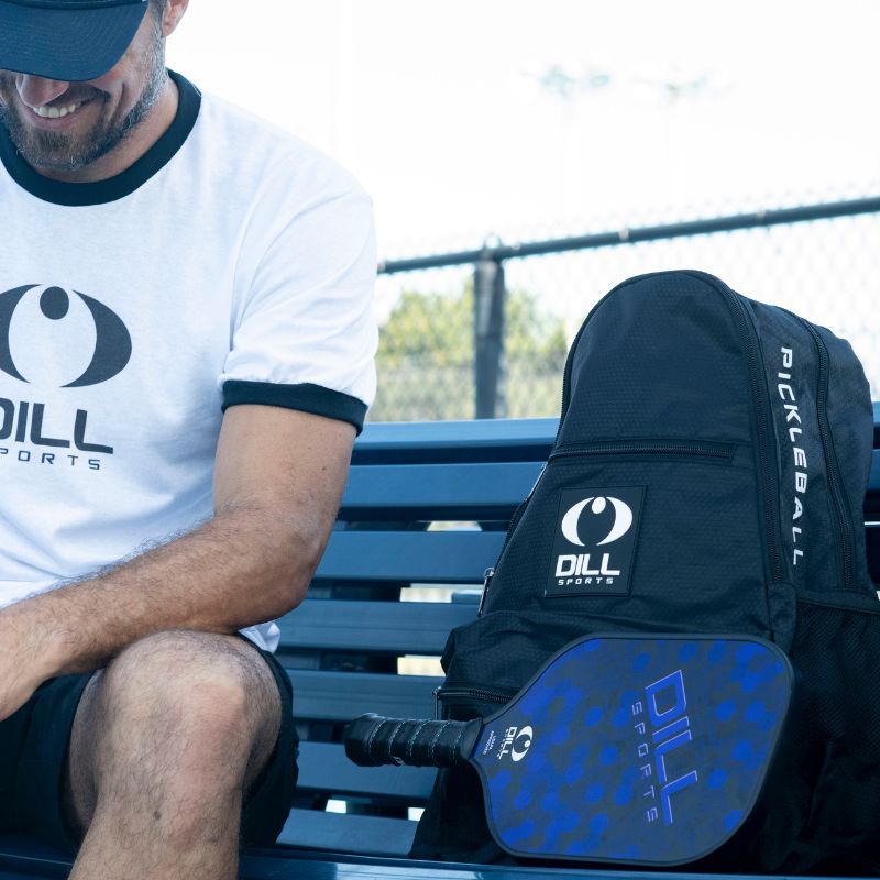 Dill Sports - black pickleball backpack on bench