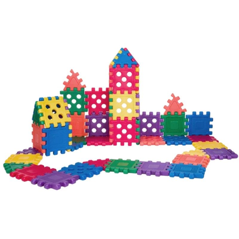 Multicolor plastic building blocks arranged to form small towers and a winding path on a plain white background.
