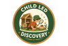 A circular green and white logo or badge reading 'CHILE LEO DISCOVER' with a central illustration of a person holding a basket of chili peppers.