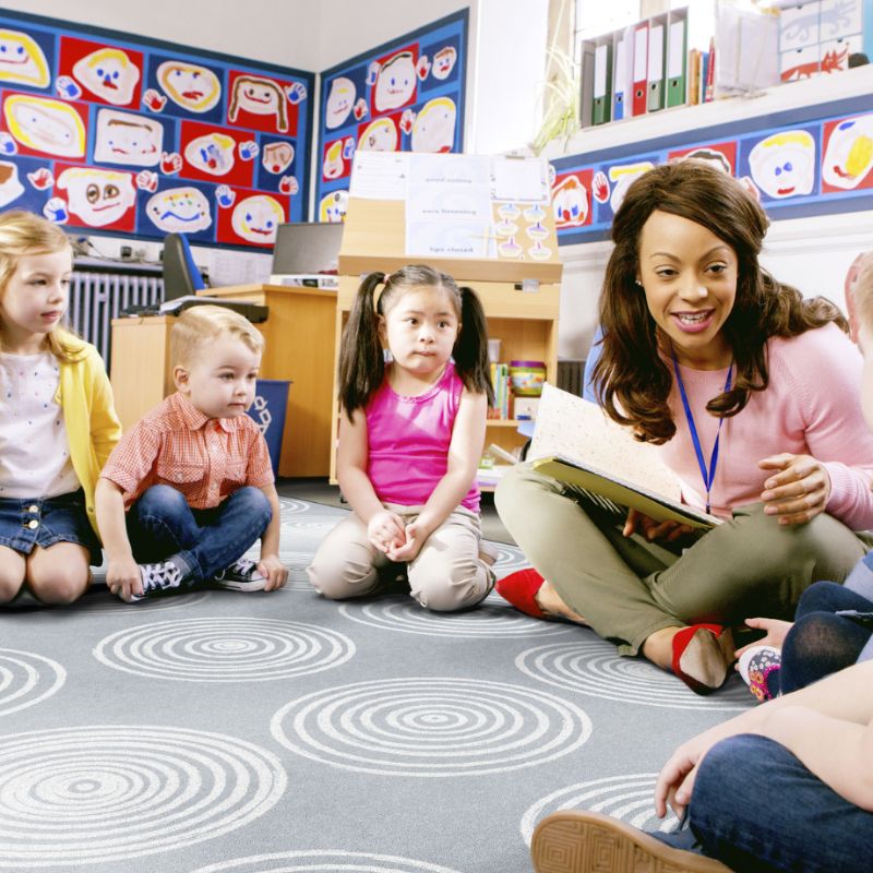 The Circles Grey & White Seating Circles Classroom Rug has a modern design used in classrooms