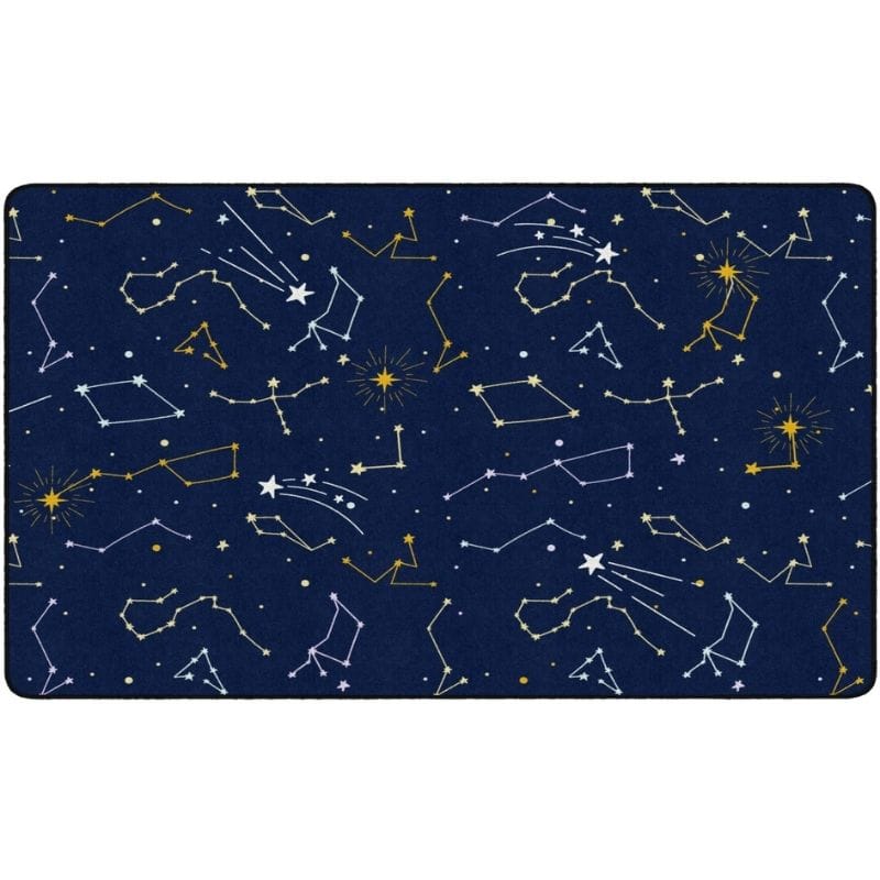 A rectangular area rug featuring a dark navy blue space-themed pattern with white and yellow constellations, stars, and shooting stars.