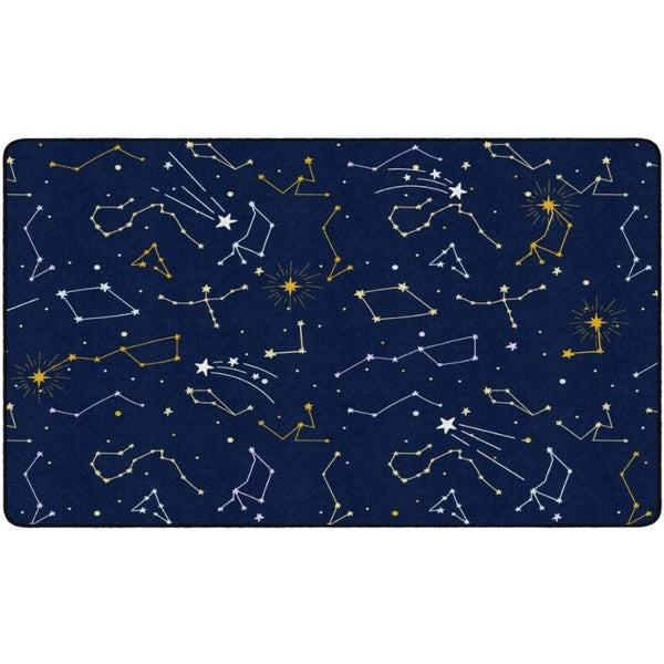 A rectangular area rug featuring a dark navy blue space-themed pattern with white and yellow constellations, stars, and shooting stars.