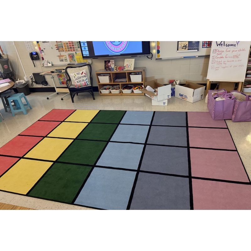 Pop of Color  grid rug in a classroom setting with educational materials and furniture.