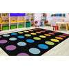 The Rainbow Spots Criss Cross Rug has child friendly colors on a crisp black background