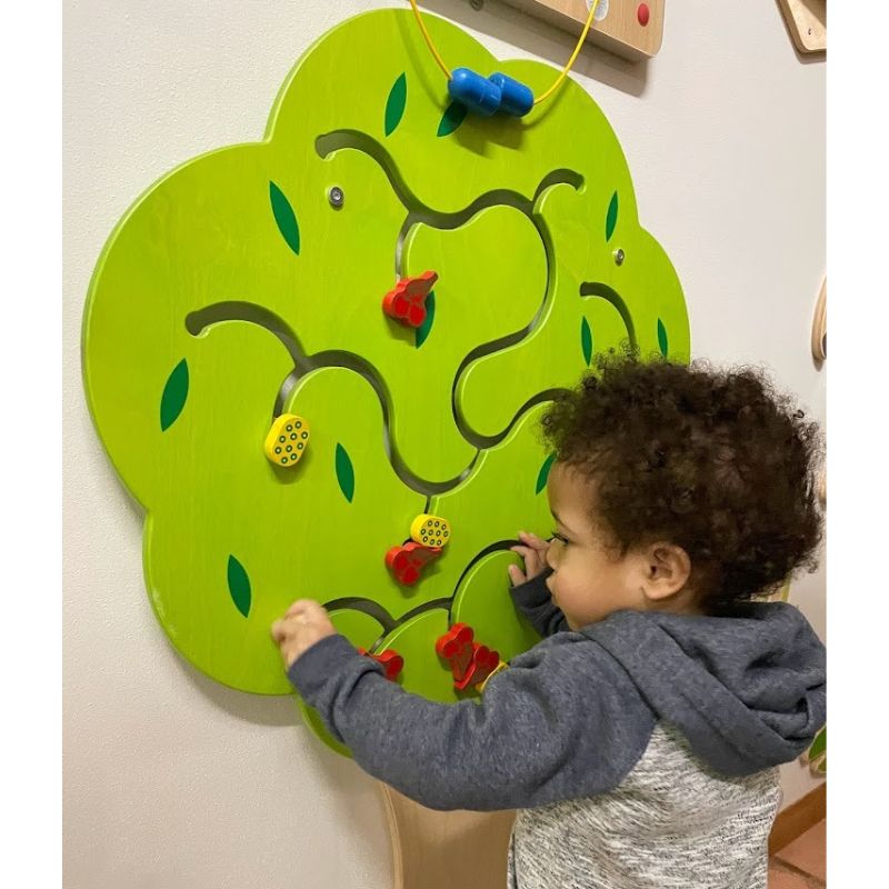 The Birch Wood Fruit Tree includes 11 vibrant pieces that children can slide back and forth along the path, allowing them to practice their fine motor skills.