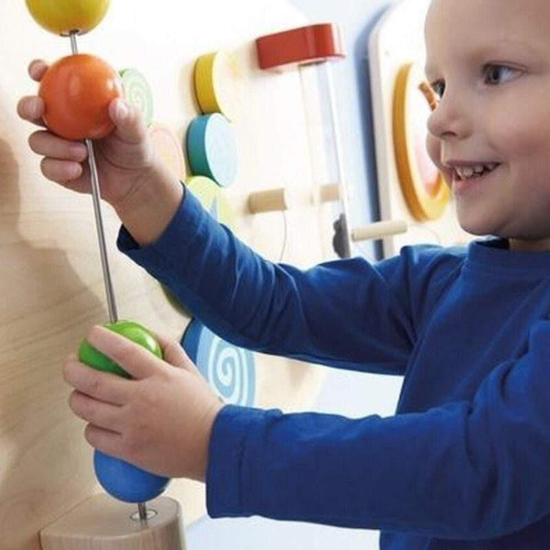 The Motor Skills E Learning Wall has suspended sliding balls, colorful gears to turn, and magic magnetic dust tube teach children science, color, and motion. 